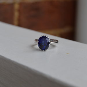 Lady's oval sapphire ring in simple prong setting