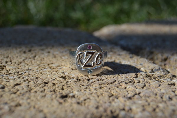 Custom designed two tone family ring with initials and gemstones