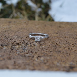 Custom designed princess diamond engagement ring with diamond twist shank