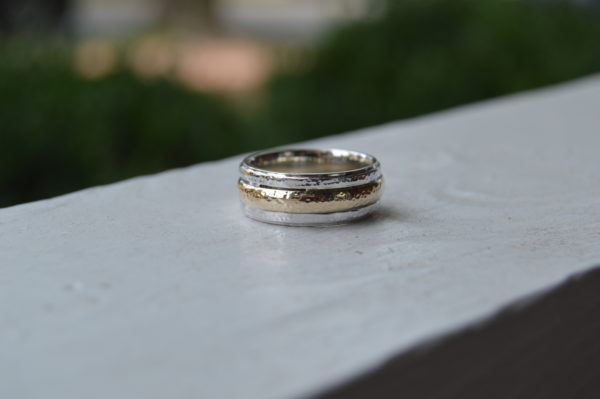 Custom made gents two tone wedding band using client's 4mm yellow gold band inlaid into white gold band with light hammered pattern