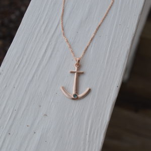 Custom designed anchor pendant with bezel set synthetic alexandrite and text on back in rose gold
