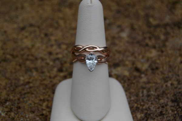 Rose gold wedding set with infinity design and pear shaped diamond