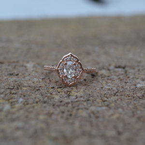 Custom designed Oval Diamond Halo Engagement Ring in Rose Gold
