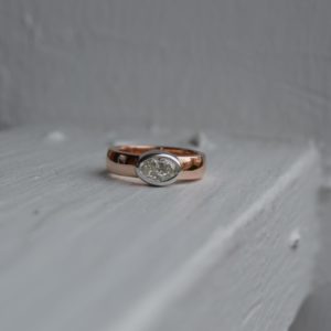 Custom Designed East-West Oval Diamond Bezel Ring with Rose and White Gold