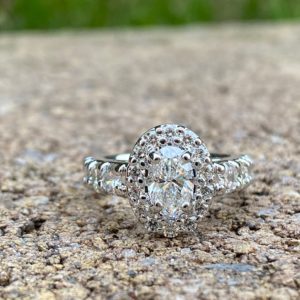 Custom Designed White Gold Oval Halo Engagement Ring with Shared Prong Diamond Shank