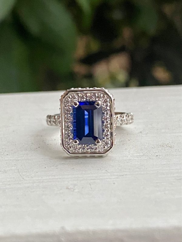 Custom Designed Emerald Cut Sapphire and Diamond Halo Ring with Diamond Shank
