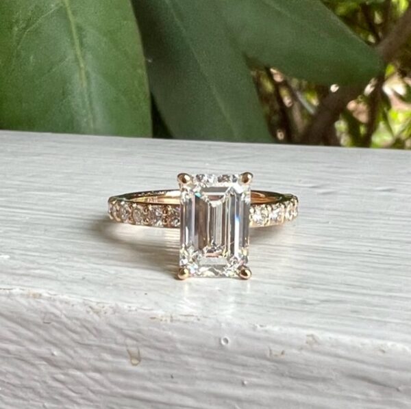 Custom Designed Emerald Cut Diamond Engagement Ring with Round Diamonds in Shared Prong Shank