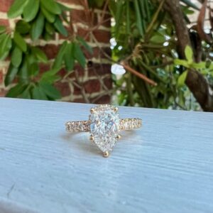 Custom Designed Pear Shaped Diamond with Hidden Halo and Diamond Shank Engagement Ring