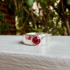 Custom Designed Two Tone Wide Band with Round Ruby Gemstone