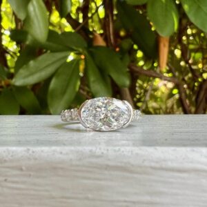 Custom Designed Oval Diamond Ring with Half Bezel and Diamond Shank